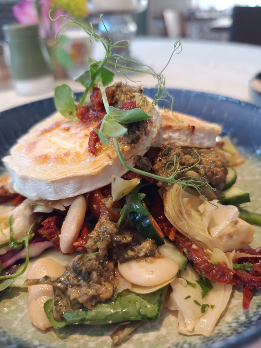 Warm goats cheese with Tuscan beans, sundried tomato and chimichurri